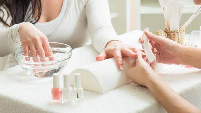 Brushing the nail for manicure